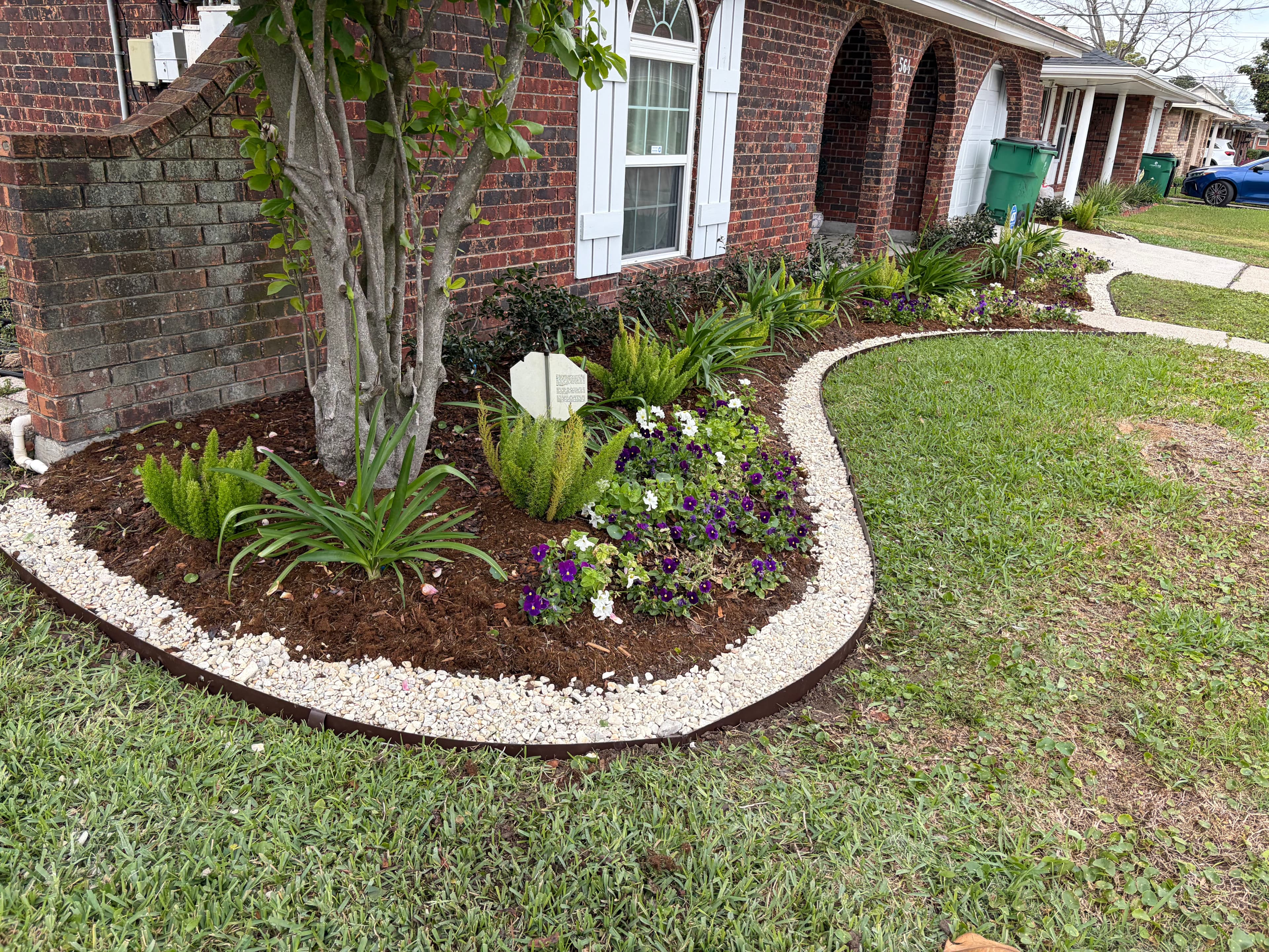 Project Elegant Garden Makeover with Metal Edging and River Rock Delight image