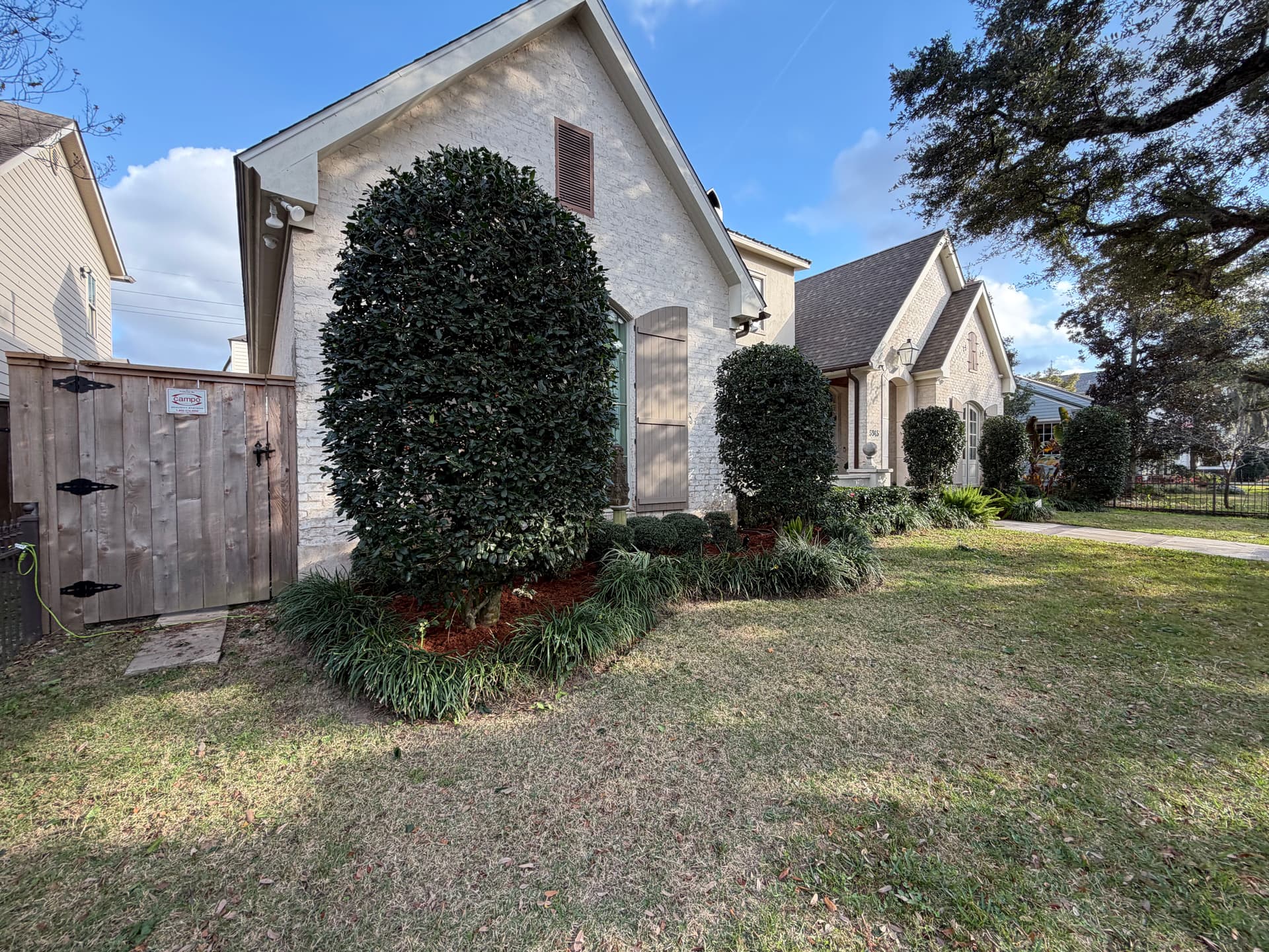 Enhanced Curb Appeal with Fresh Mulch and Trimmed Shrubs
