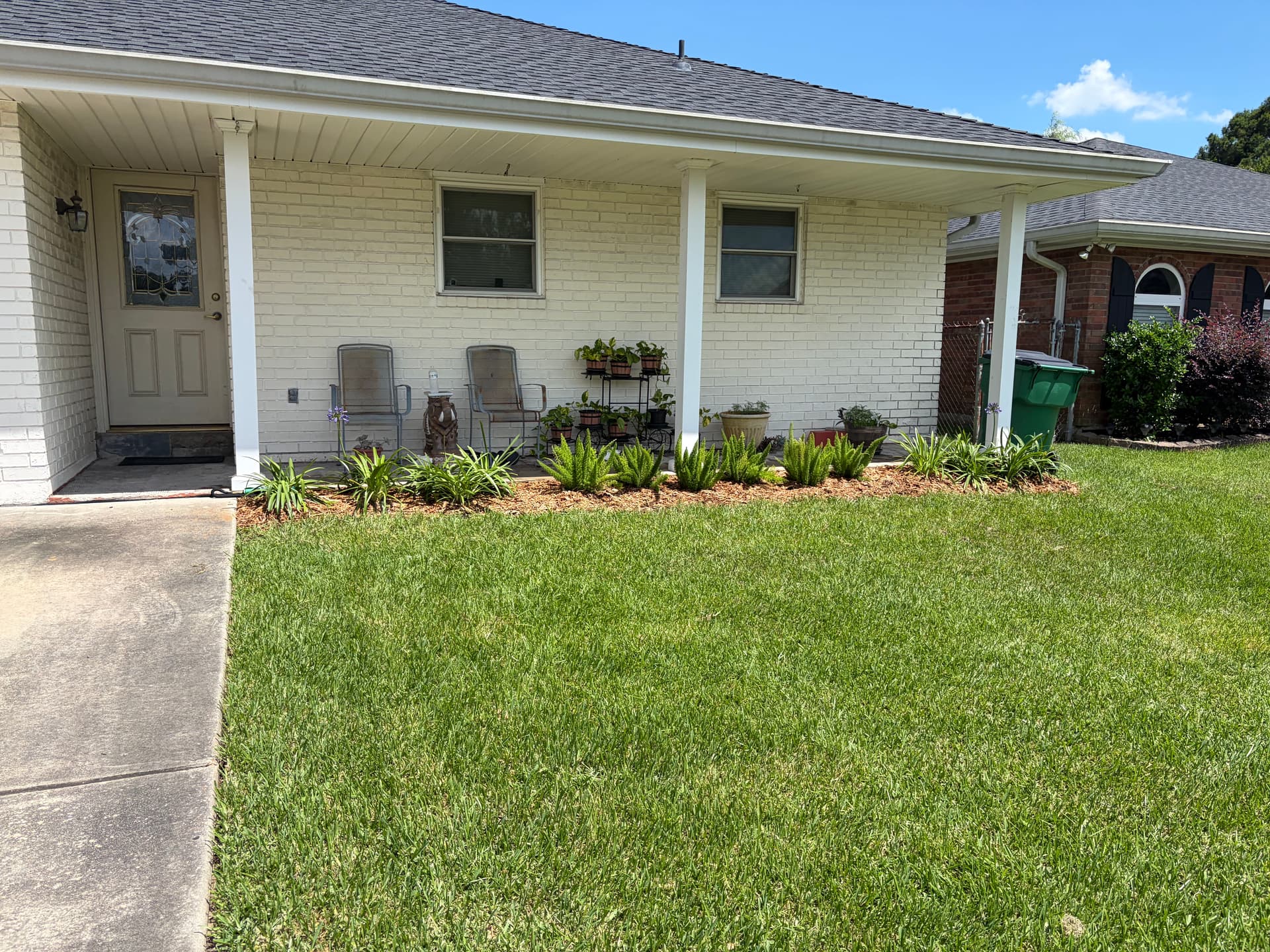 Gallery photos for Grassy Strip Turned Clean Garden Bed with Fresh Plants and Mulch: Image #4